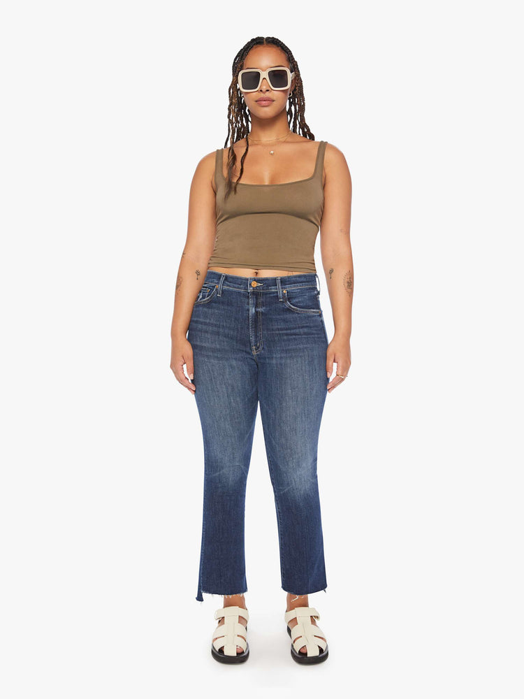 Front view of a womens dark denim wash jean featuring a high rise and a bootcut step fray.