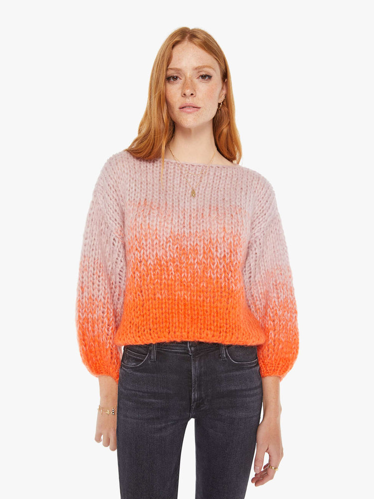 Front view women's long sleeve sweater in colors orange and pink.