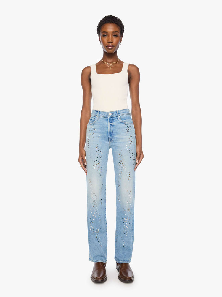 Front view of a woman in a light blue with crystal embellishments high-rise straight-leg jean with a zip fly, 32-inch inseam and a clean hem. 