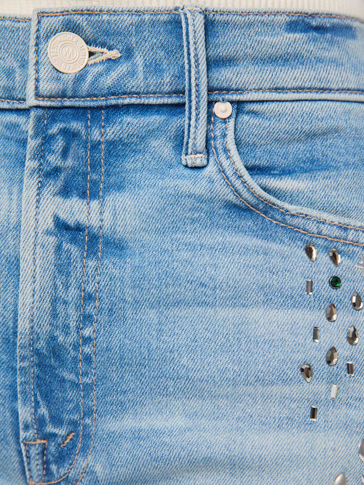 Slack view of a woman in a light blue with crystal embellishments high-rise straight-leg jean with a zip fly, 32-inch inseam and a clean hem. 