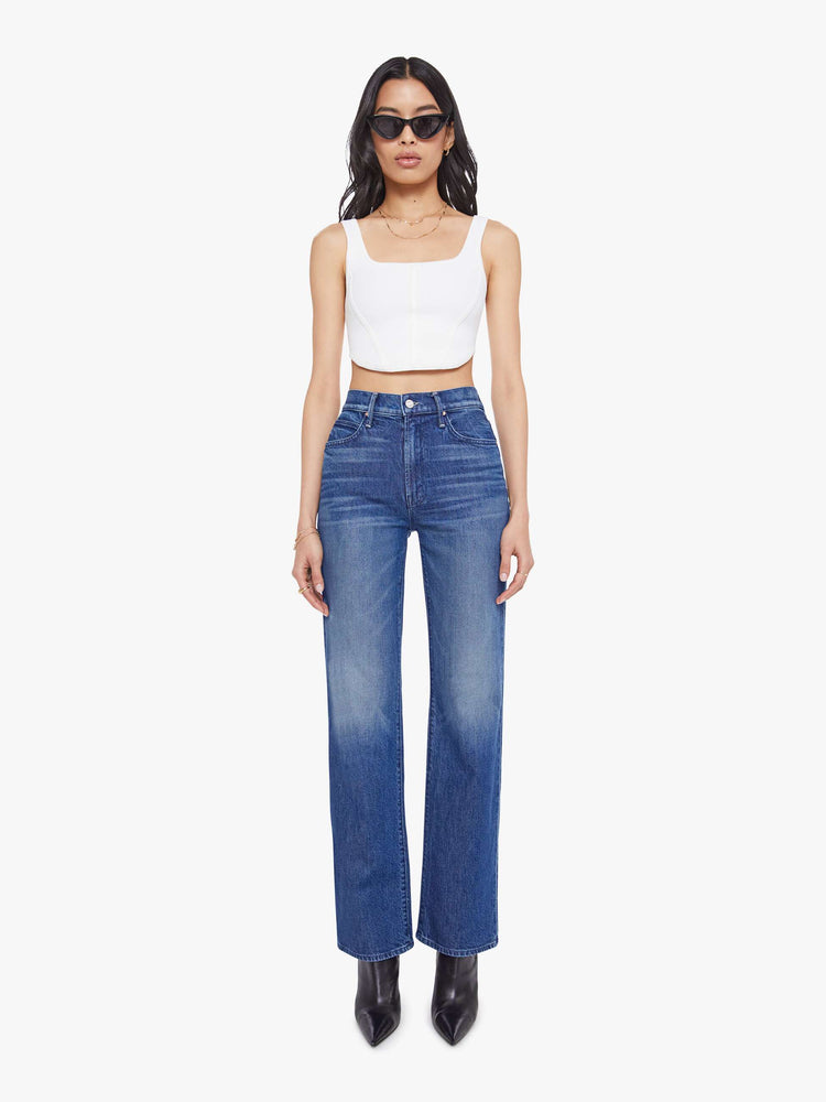 Front view of a woman in a high-rise straight leg jean with a zip fly, 32-inch inseam and a clean hem. 