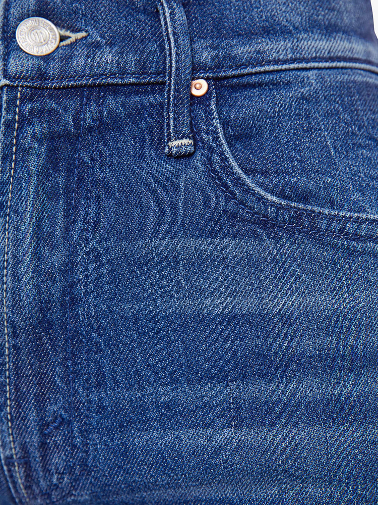 Swatch view of a woman in a high-rise straight leg jean with a zip fly, 32-inch inseam and a clean hem. 