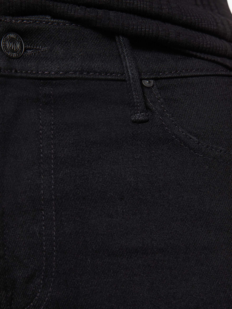 Swatch view of a woman in black high-rise straight leg jean with a 32-inch inseam and a clean hem.