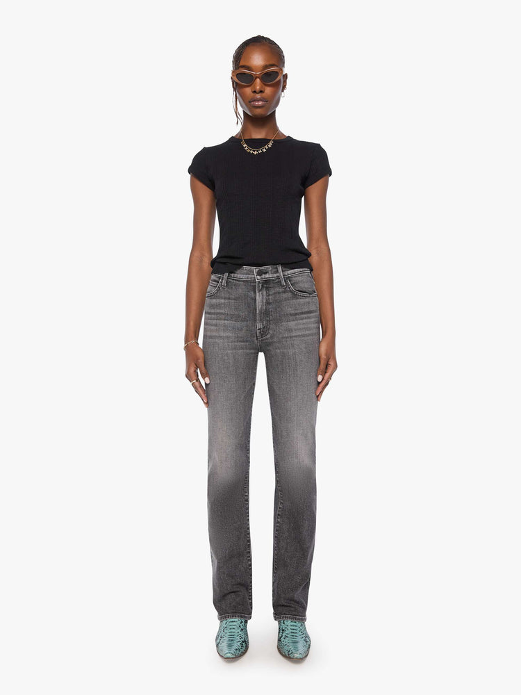 Front view of a woman in a washed black high-rise straight-leg jean with a zip fly, 32-inch inseam and a clean hem.