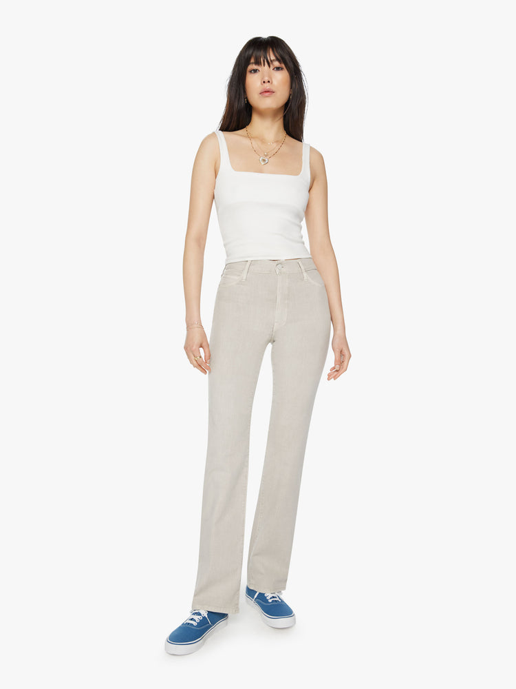 Front view of a woman off white pant with a high-rise, straight-leg with a 32-inch inseam and a clean hem.