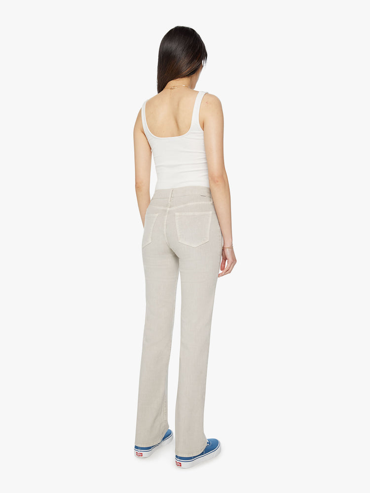 Back view of a woman off white pant with a high-rise, straight-leg with a 32-inch inseam and a clean hem.