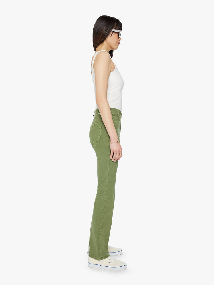 Side view of a woman high-rise, straight-leg with a 32-inch inseam and a clean hem pant in a stone green color.