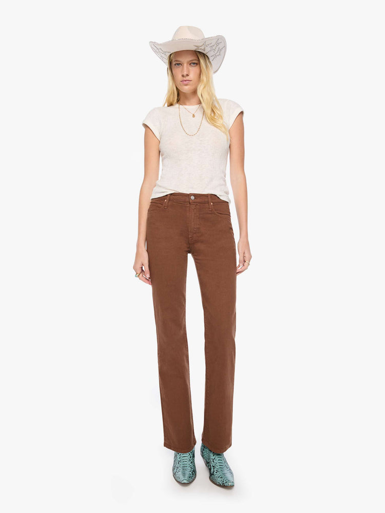 Front view of a woman in a rich brown high-rise straight-leg pant with a zip fly, 32-inch inseam and a clean hem.