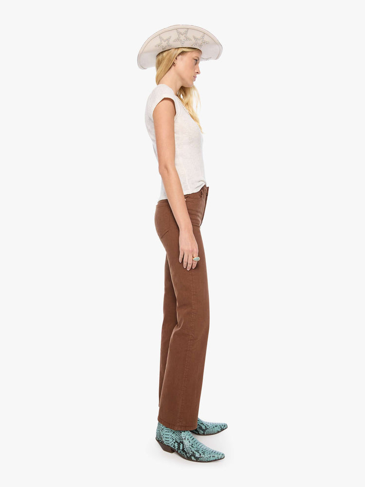 Side view of a woman in a rich brown high-rise straight-leg pant with a zip fly, 32-inch inseam and a clean hem.