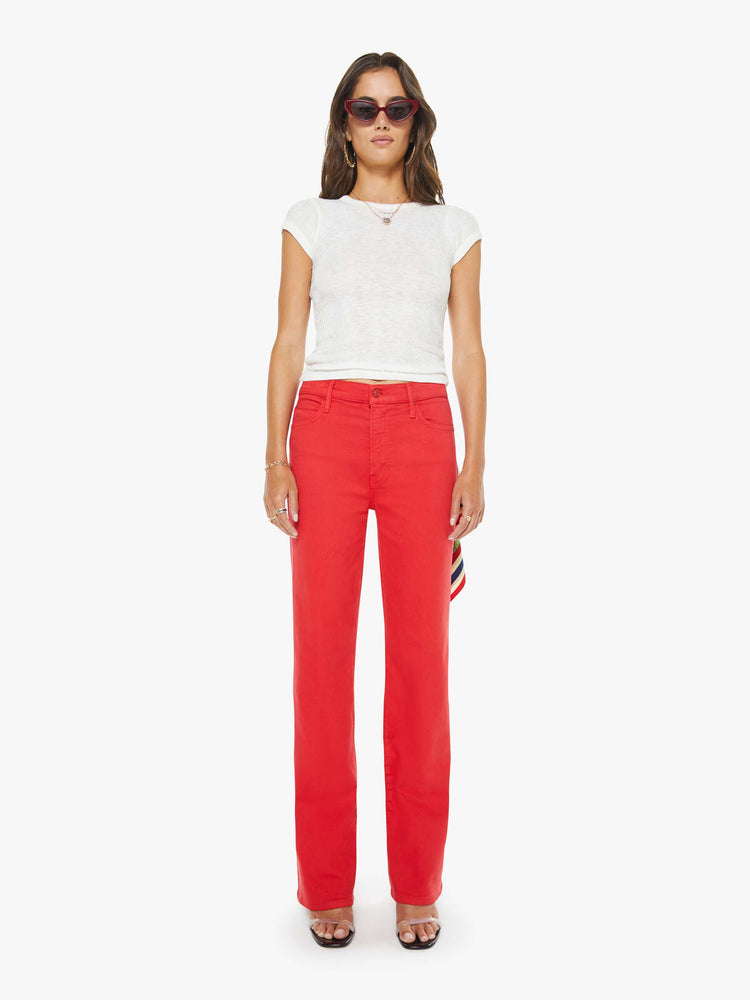 Front view of a woman in a red high-rise straight-leg jean with a zip fly, 32-inch inseam and a clean hem.