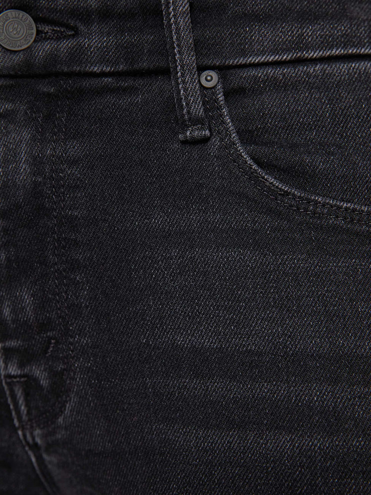 Swatch view of a woman in a black skinny has a mid rise with a zip fly, 29-inch inseam and a clean hem.