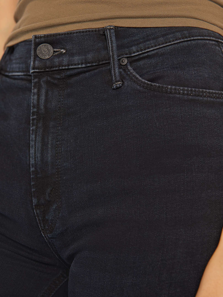 Swatch view of a woman classic mid-rise bootcut with a long 34-inch inseam and a clean hem in a dark blue wash.