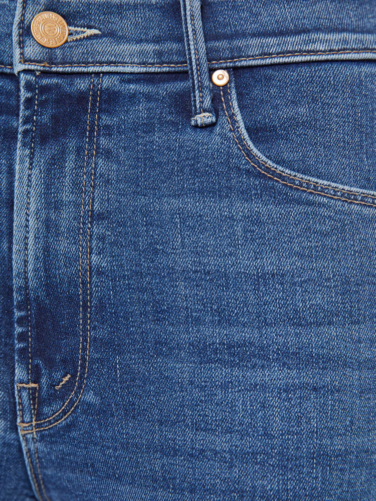 Swatch view of a woman in a skinny flare with a mid rise, zip fly and a long 34-inch inseam with a clean hem.