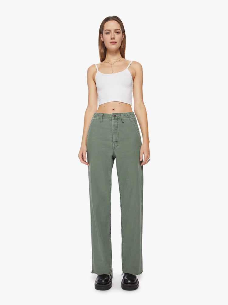 Front view a woman army green super high waisted pants with a loose straight leg, side slit pockets, a long 33.5-inch inseam and a frayed hem.