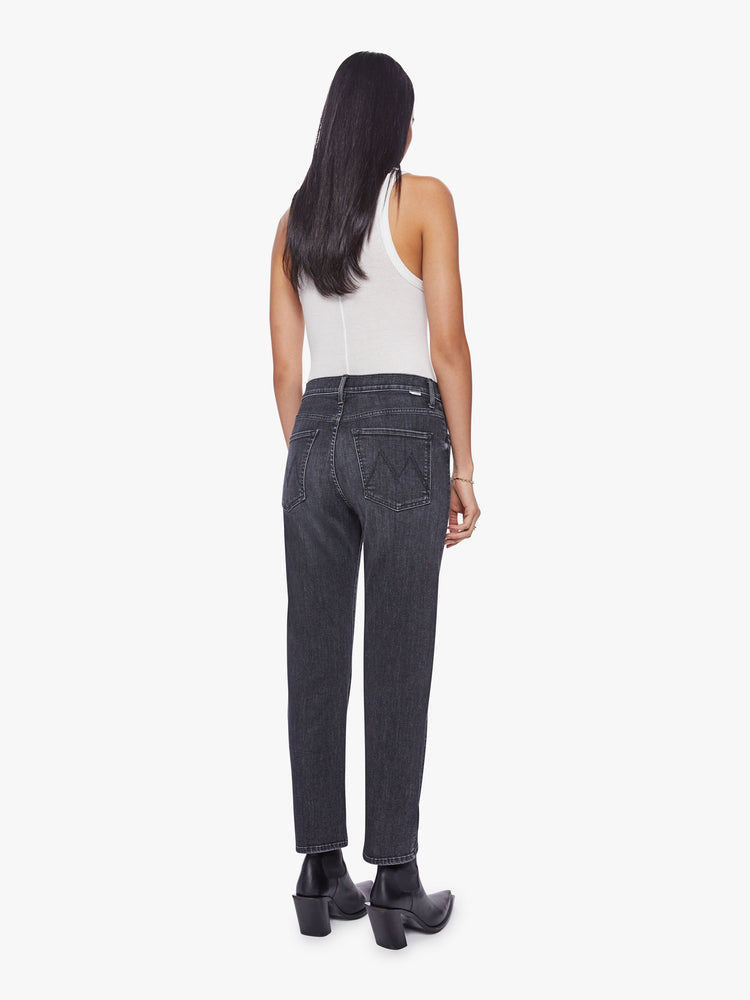 Back view of a woman faded black ankle-length jeans with a zip fly, slouchy straight leg and relaxed fit that's designed to sit on the hips.