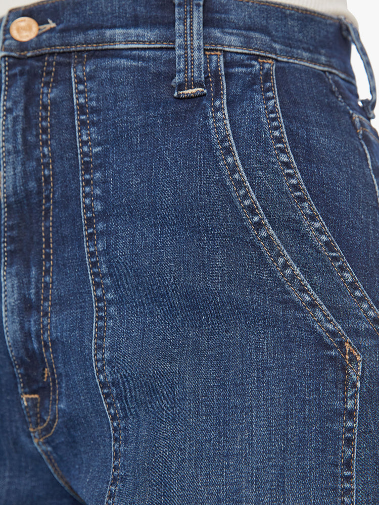 Swatch view of a woman wide straight-leg jeans with a super high rise, oversized double patch pockets and a clean hem in a dark blue wash.