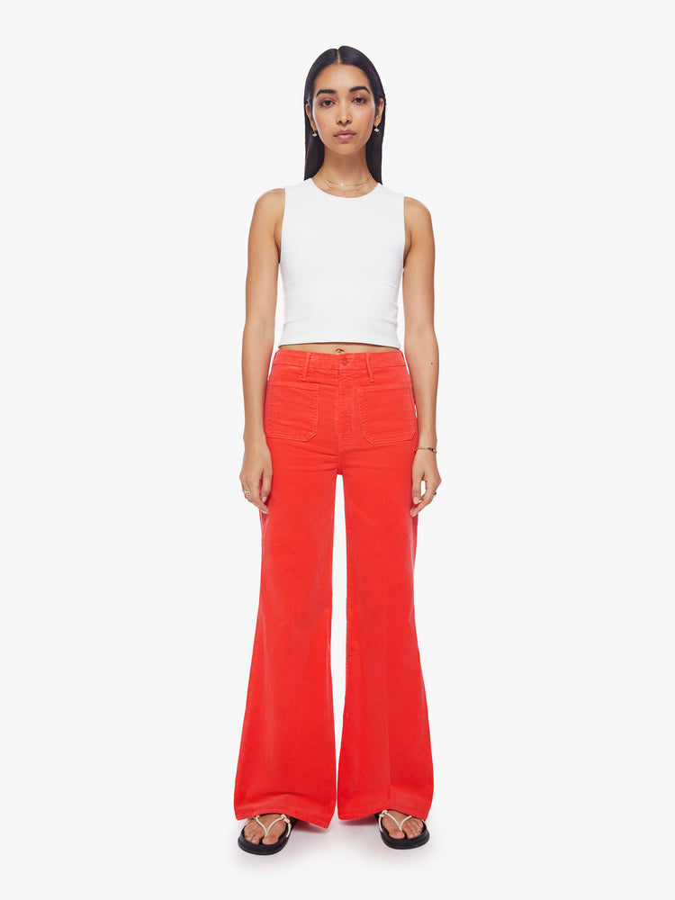 Front view of a woman wide-leg pants with a high rise, long inseam, patch pockets and a clean hem in a bright orange-red hue.