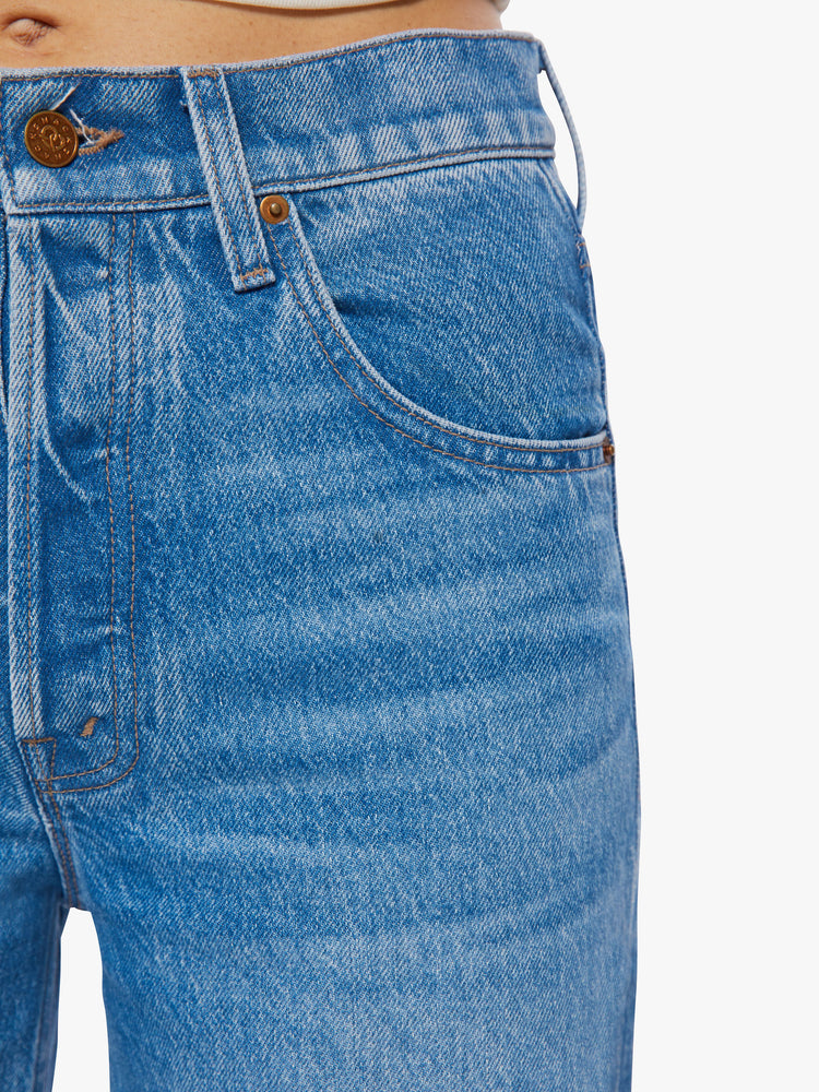 Swatch view of a woman mid-rise wide leg jean with a button fly, slouchy, loose fit and a 30-inch inseam in a mid-blue wash.