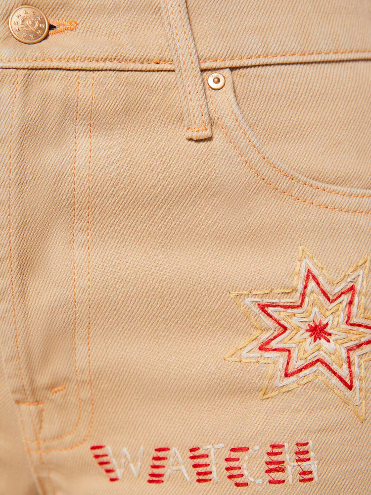 Swatch view of a woman in a khaki with colorful embroidery  wide-leg jeans are designed with a loose fit, button fly and a 30-inch inseam with a clean hem.  