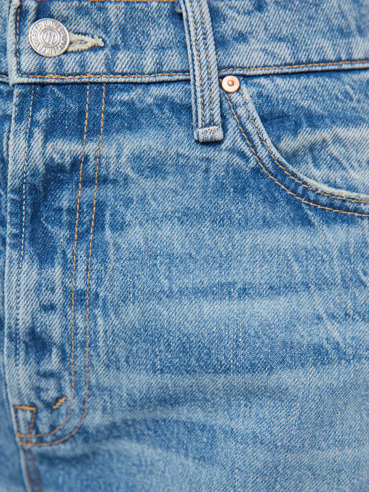 Swatch view of a woman in jeans designed to sit on the hips with a slouchy fit, a loose straight leg, zip fly and a 28.25-inch inseam with a clean hem.