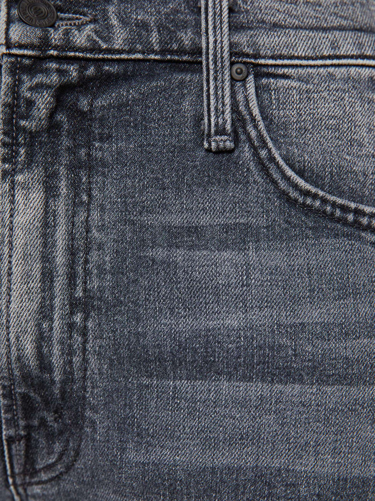 Swatch view of a woman in a dark grey Jeans designed to sit on the hips with a slouchy fit, a loose straight leg, button fly and a 28.25-inch inseam with a clean hem.