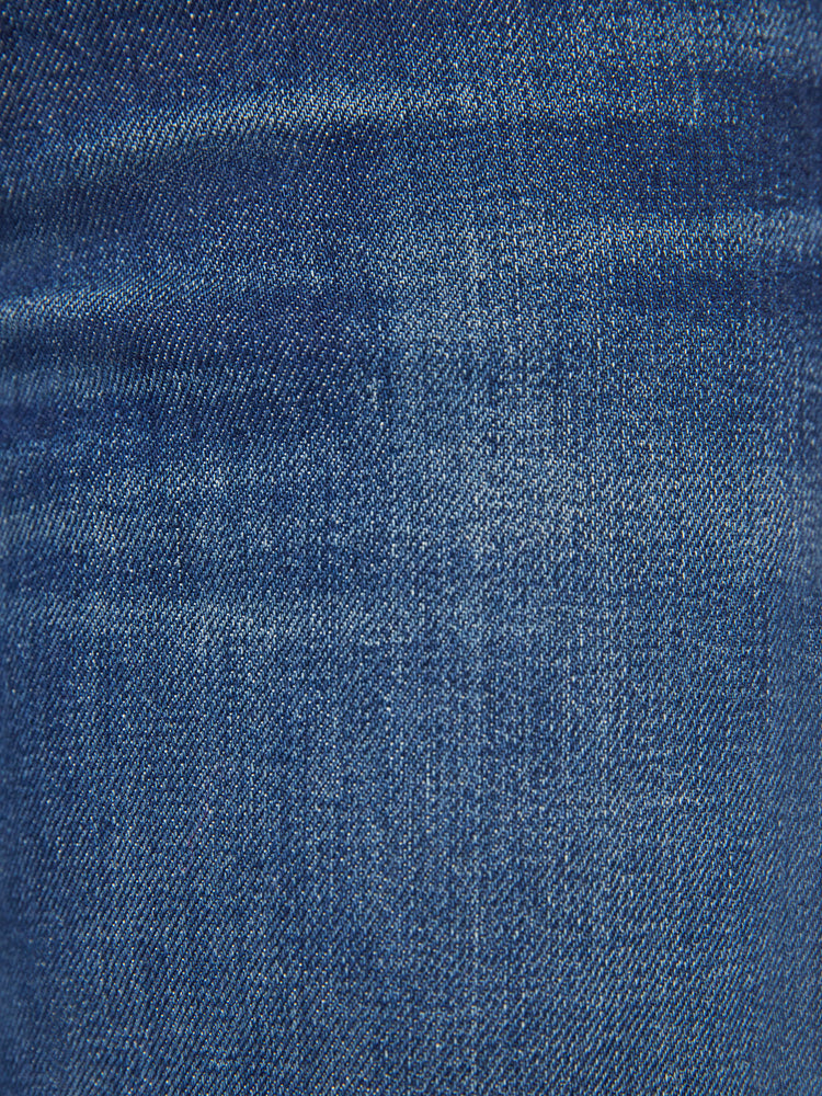 Swatch view of a woman low-rise jeans with a loose wide leg, button fly and a long 34-inch inseam with a clean hem in a dark blue wash.