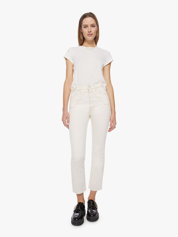Front view of a woman white jean with high-rise straight leg with Western-inspired yoke details at the waist, an ankle-length inseam and a clean hem.