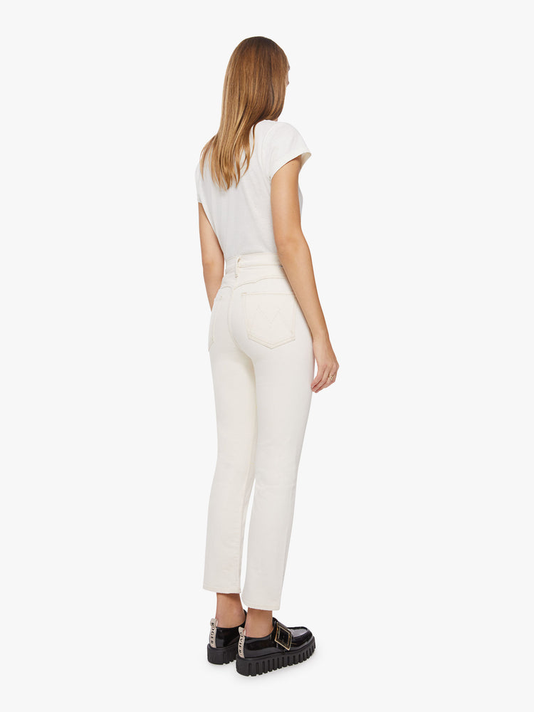 Back view of a woman white jean with high-rise straight leg with Western-inspired yoke details at the waist, an ankle-length inseam and a clean hem.