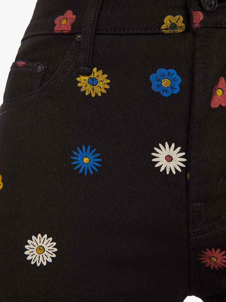 Swatch view of a woman high-rise bootcut has a 28.25-inch inseam and a clean hem in a black with flowers throughout.