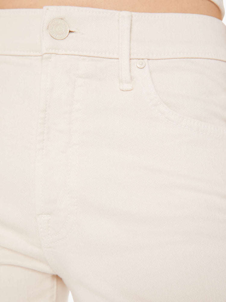 Swatch view of a woman light khaki cream colored high-rise bootcut has a 28.25-inch inseam and a clean hem pant.