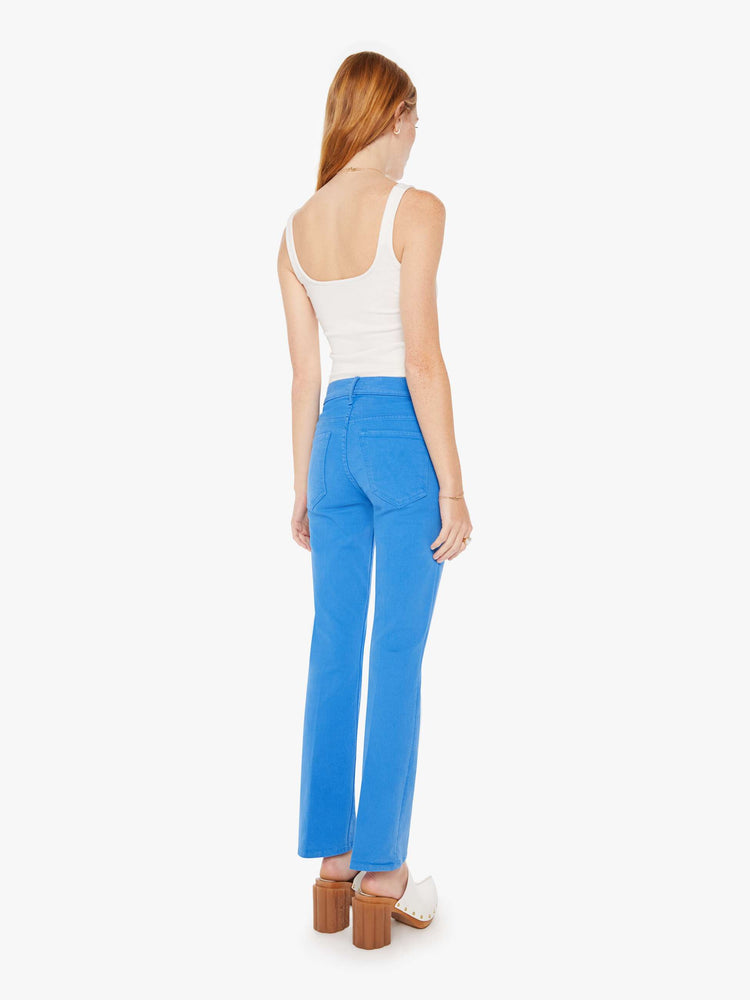 Back view of a woman high-rise bootcut has a 28.25-inch inseam and a clean hem in a bright blue.
