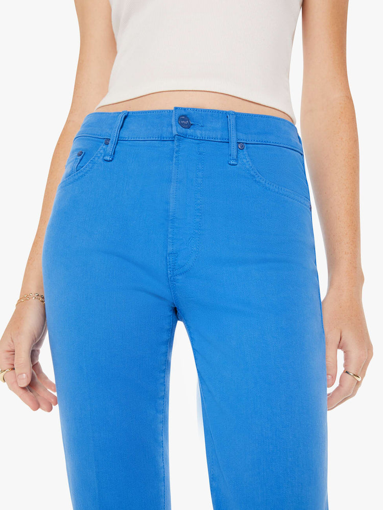 Close up view of a woman high-rise bootcut has a 28.25-inch inseam and a clean hem in a bright blue.