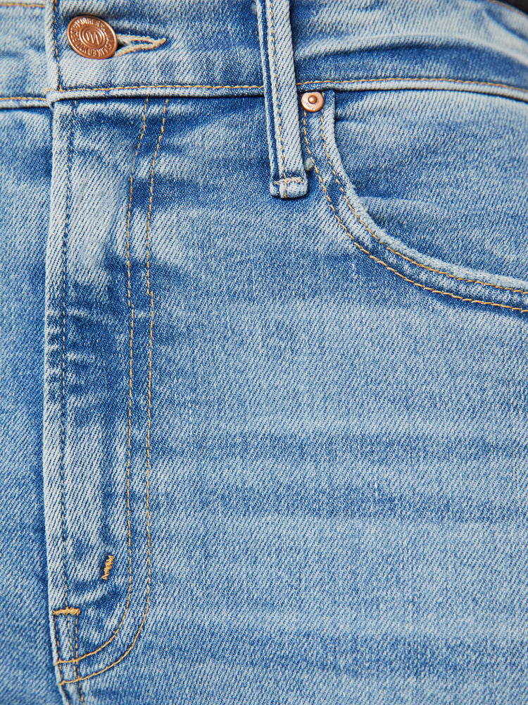 Swatch view of a woman super high-waisted jeans with a loose fit, wide leg and 31-inch inseam with a clean hem in a light blue wash.