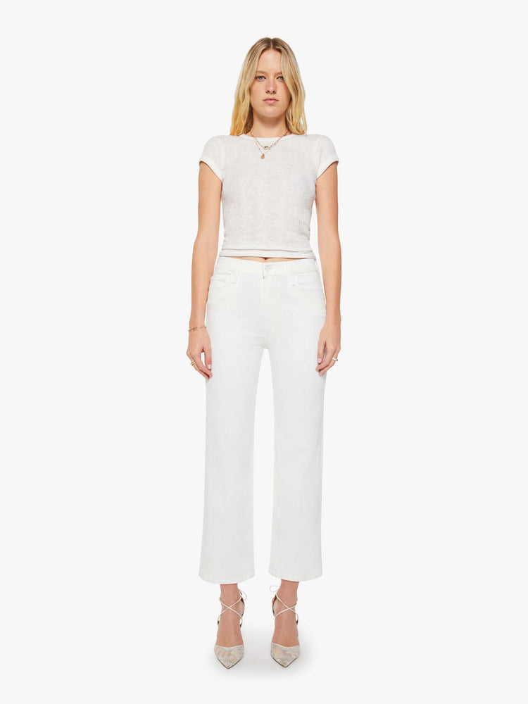Front view of a womens white high waisted wide straight leg jean with an ankle length inseam and zip fly.