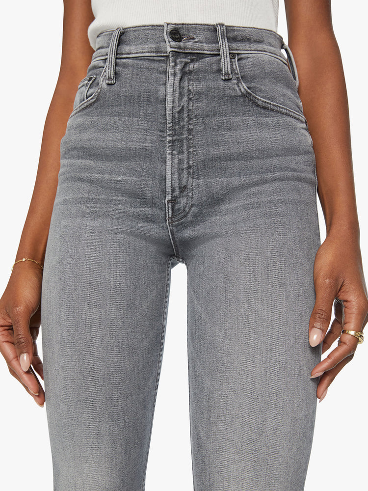 Waist view of a woman high-waisted straight leg with an ankle-length inseam and a clean hem in a faded grey wash.