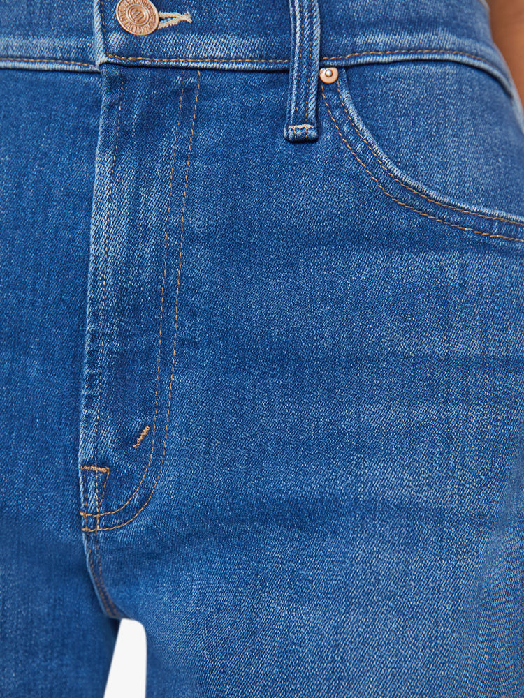 Swatch view of a woman mid rise straight-leg jeans with a zip fly, 31-inch inseam and relaxed fit in a mid blue wash.