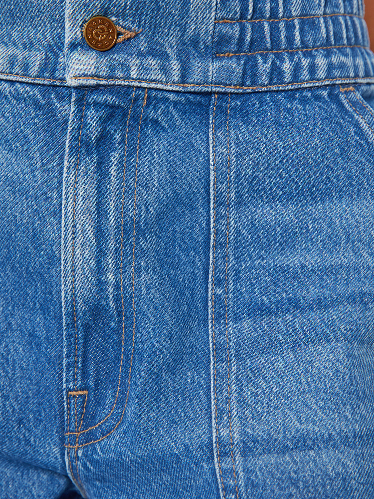 Swatch view of a women ultra wide-leg jeans are designed with a high rise, elastic waist, drop crotch, utility-inspired patch pockets and a long 32-inch inseam with a cuffed hem in a mid-blue wash.
