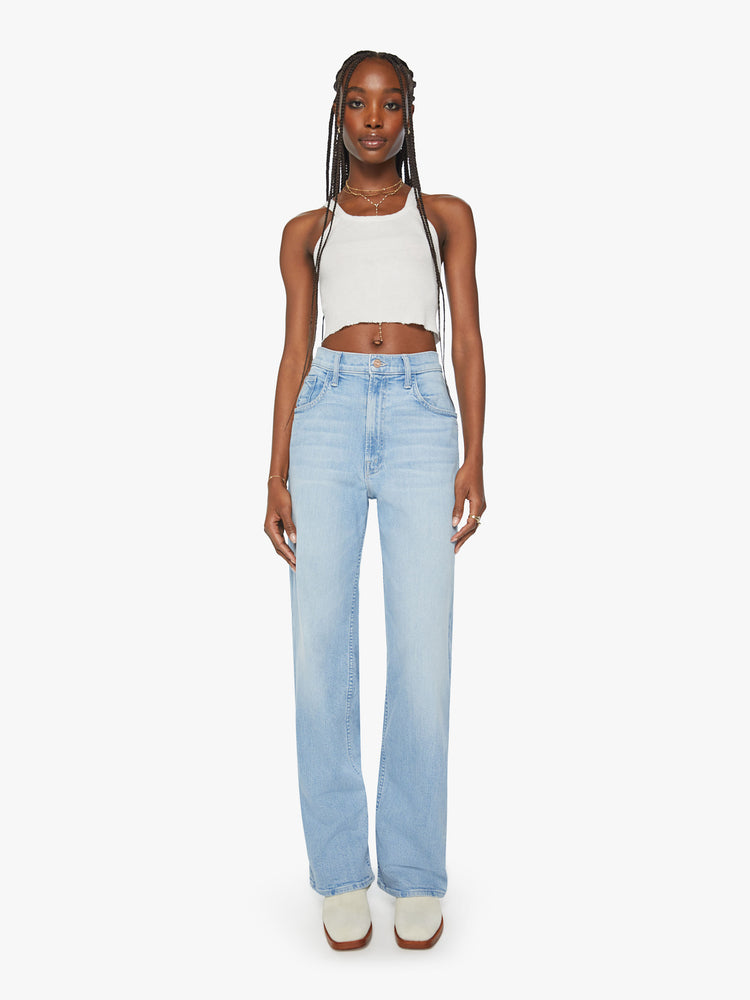 Front view of a woman super high-rise jeans with a loose wide leg, zip fly and a long 34-inch inseam and a clean hem in a light blue denim.