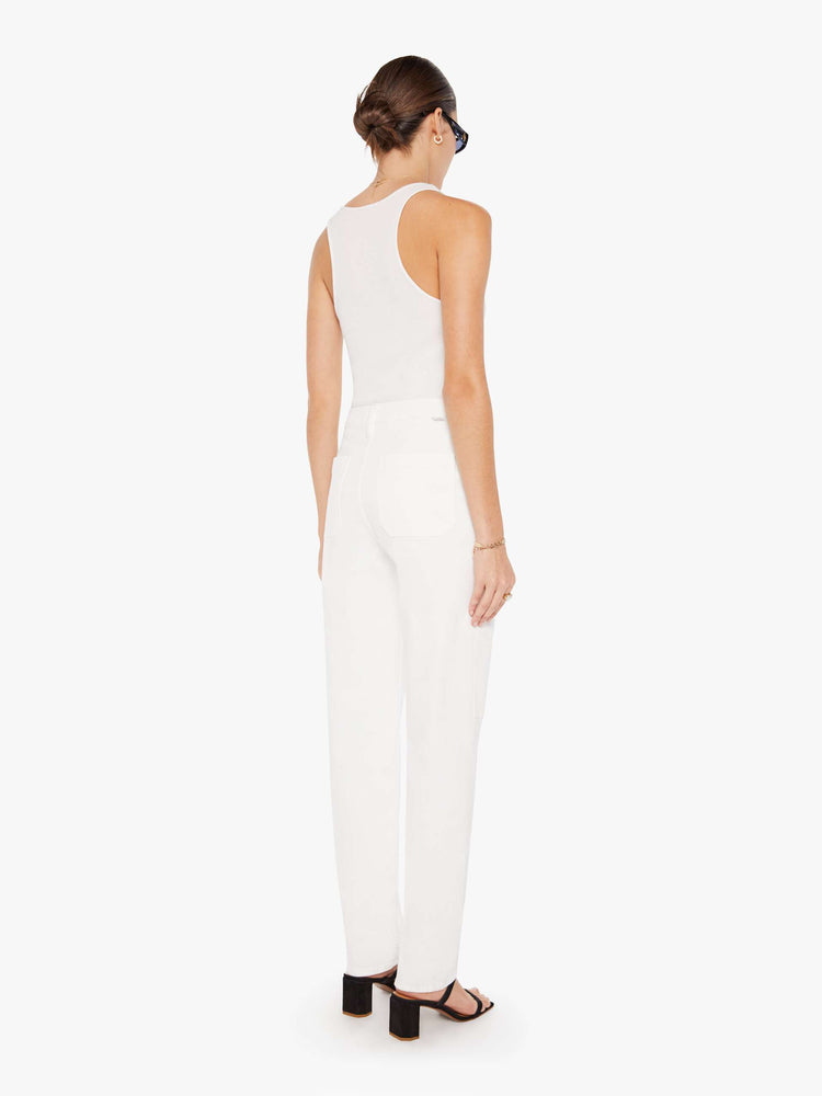 Back view of a womens white cargo pant featuring a super high rise and straight leg.