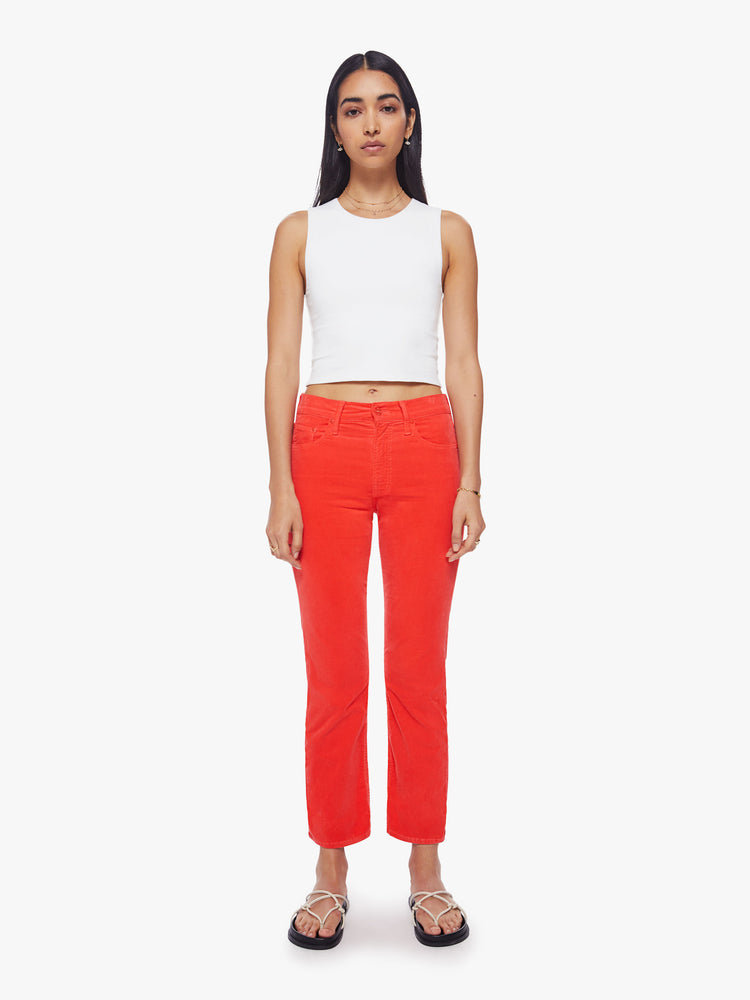 Front view of a woman mid-rise straight leg with an ankle-length inseam and a clean hem in a bright orange-red hue corduroy fabric.