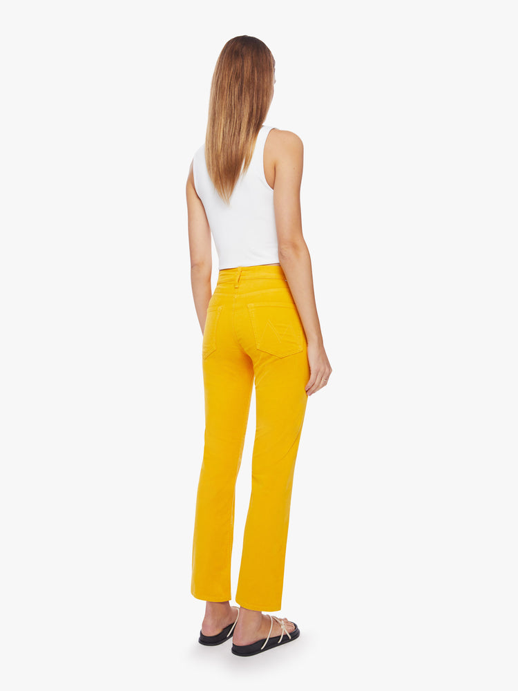 Back view of a woman mid-rise straight leg with an ankle-length inseam and a clean hem in a yellow hue corduroy fabric.
