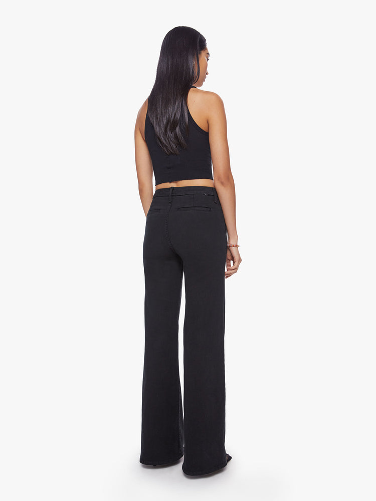 Back view of a woman high-waisted wide leg pant features back slit pockets, a 34-inch inseam and a clean hem in a solid black hue.