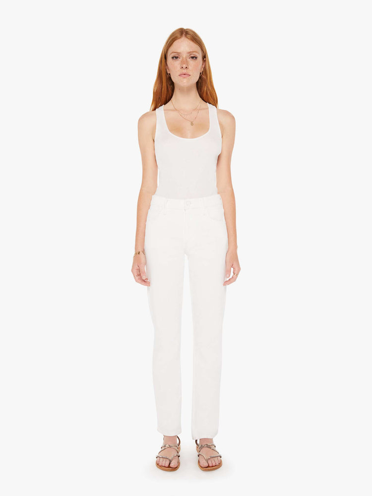 Front view of a womens white denim featuring a high rise and a straight leg.