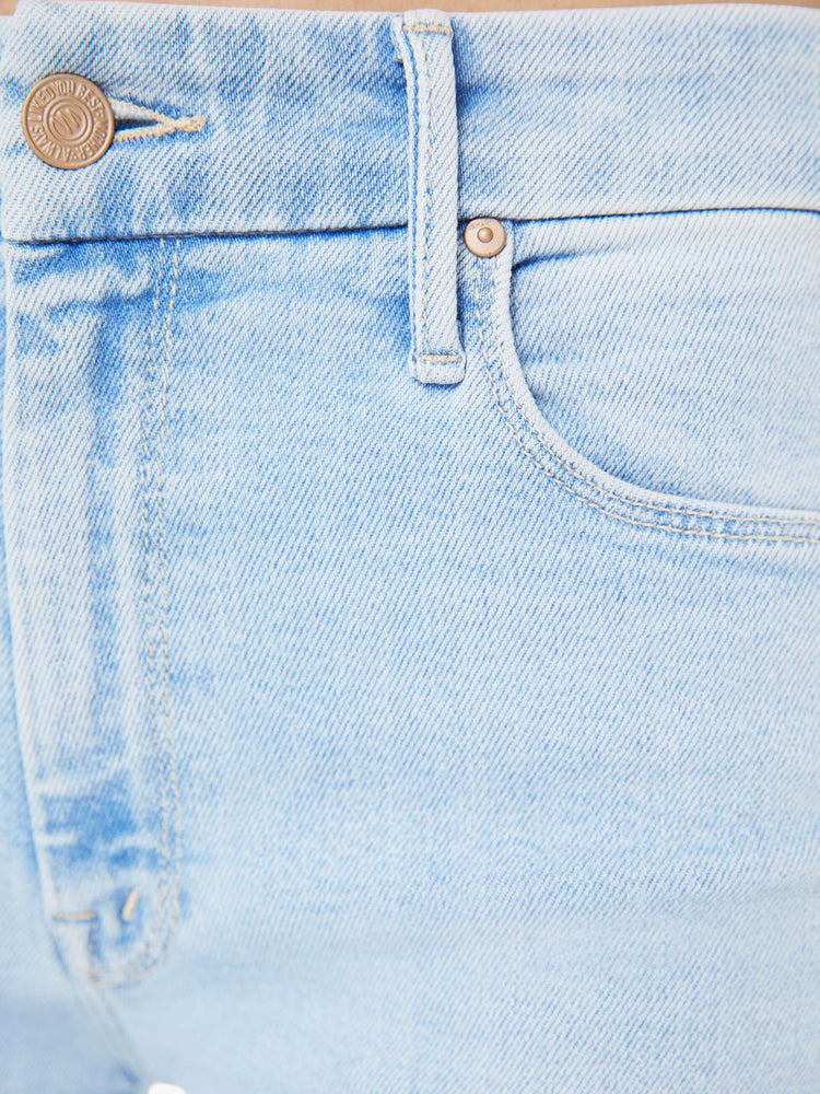 Swatch view of a woman in a wide-leg jeans with a mid rise, 32-inch inseam and a clean hem in a light blue wash.