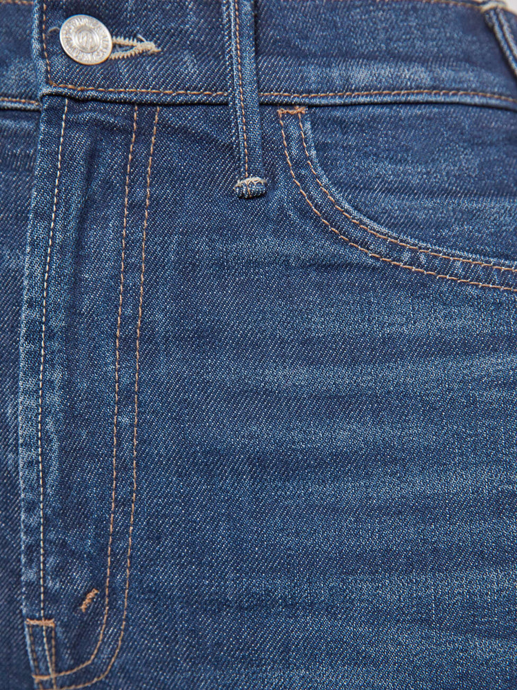 Swatch view of a woman in a  high-rise flare has a zip fly, 28.25-inch inseam and a frayed hem.