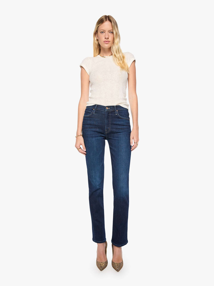 Front view of a woman in dark blue mid-rise straight-leg with a zip fly, long 31-inch inseam and a clean hem.