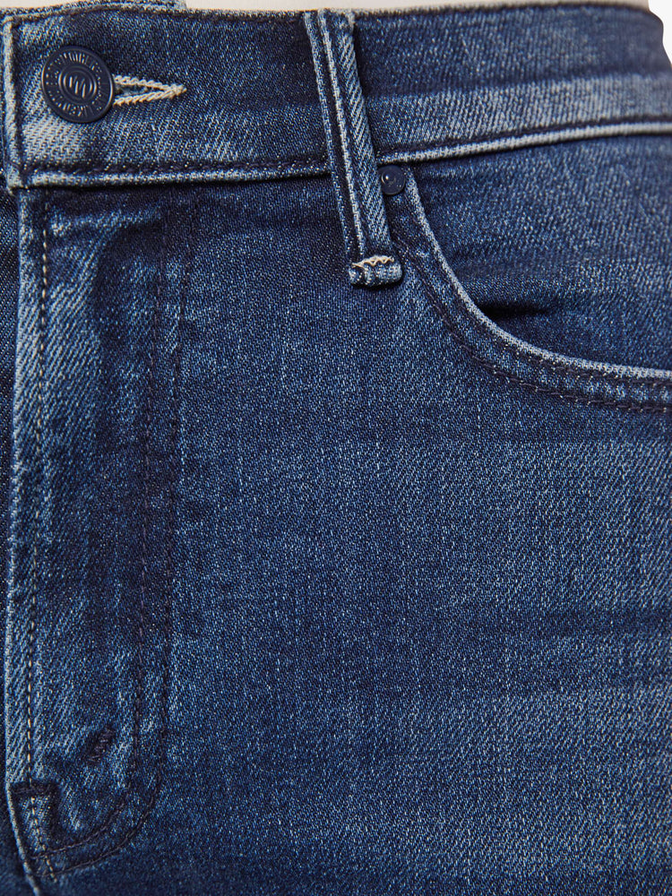 Swatch  view of a woman in a dark blue mid-rise straight leg with a zip fly, long 31-inch inseam and a clean hem.