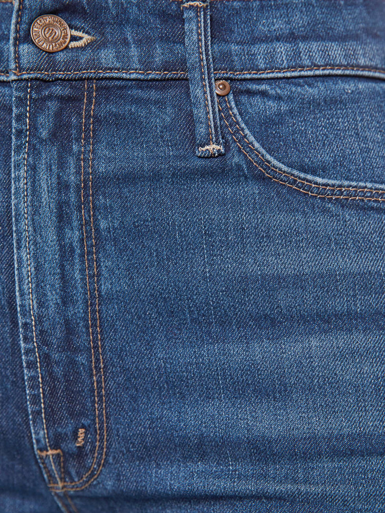 Swatch view of a woman in a skinny flare with a high rise, zip fly and a long 34-inch inseam with a clean hem.