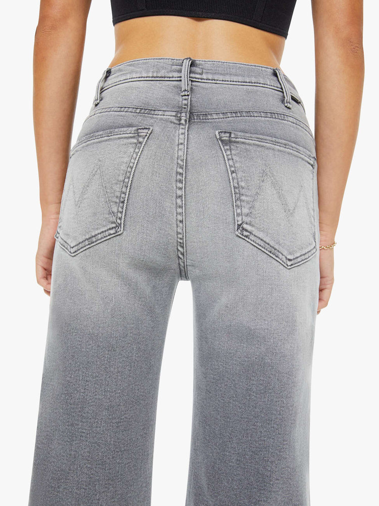 Back close up view of a woman in grey wide leg pants with a zip fly, high rise, 31-inch inseam and a clean hem.