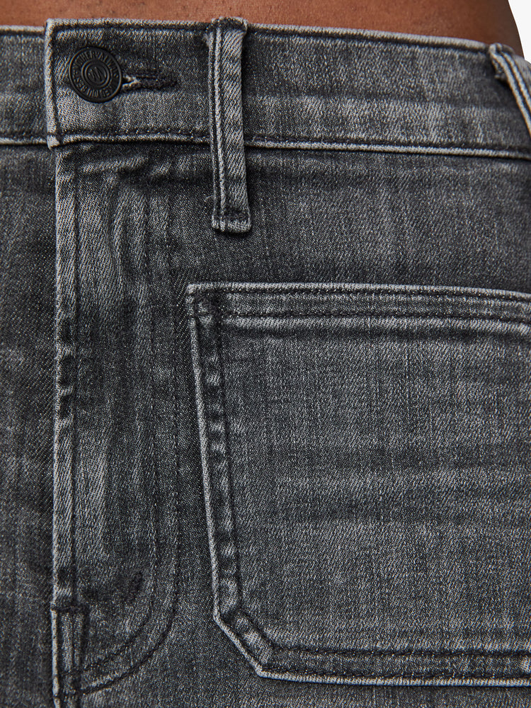 Swatch view of a woman wide leg jean with a high rise, patch pockets, a 31-inch inseam and a clean hem in a faded black.